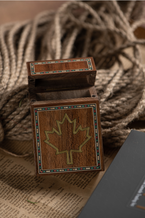 Woodbox made of high-quality wood with a Canadian maple leaf.